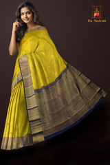 Lime Green Kanchipuram Silk Saree with embossed on the body with Peacock blue contrast border and Thick mayil kan