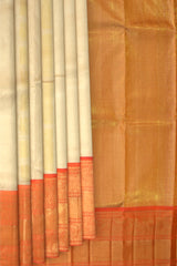 Off White Kanchipuram Silk Saree with Tissue zari on the body with Orange contrast border and Orange annam pallu