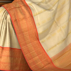 Off White Kanchipuram Silk Saree with Tissue zari on the body with Orange contrast border and Orange annam pallu