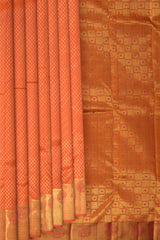 Peach Kanchipuram Silk Saree with Tear drop Jackard on the body with Peach self border and Orange Pink Square with thick butta pallu