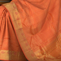Peach Kanchipuram Silk Saree with Tear drop Jackard on the body with Peach self border and Orange Pink Square with thick butta pallu