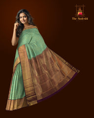 Copper Sulphate Blue Kanchipuram Silk Saree with Floral Jackard on the body with Wine Purple contrast border and Wine Purple Grand Pallu with mango design pallu