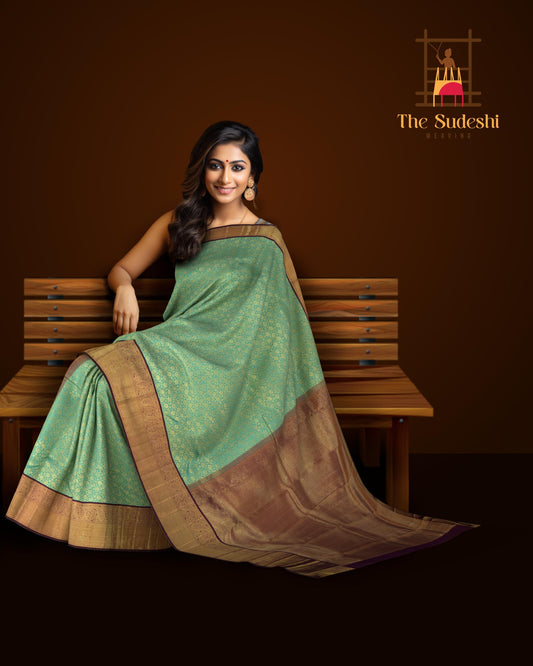 Copper Sulphate Blue Kanchipuram Silk Saree with Floral Jackard on the body with Wine Purple contrast border and Wine Purple Grand Pallu with mango design pallu