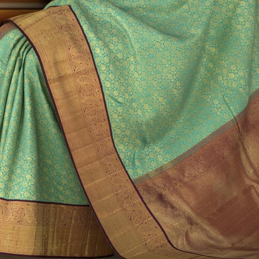 Copper Sulphate Blue Kanchipuram Silk Saree with Floral Jackard on the body with Wine Purple contrast border and Wine Purple Grand Pallu with mango design pallu