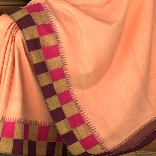 Peach Kanchipuram Silk Saree with Korvai Plain on the body with Beetroot and pink and gold checks border and Magenta Tissue pallu