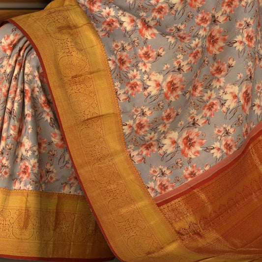 Grey with red flowers Kanchipuram Silk Saree with Floral digital Plain on the body with Red contrast border and Red pallu with diagonal lines and floral motif pallu
