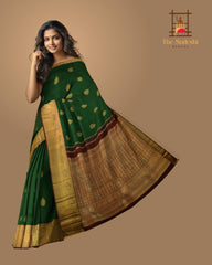 Dark Green Kanchipuram Silk Saree with Motif Leaf Plain on the body with Arakku Brown contrast border and Maroon Yaali, peacock, kamalam pallu