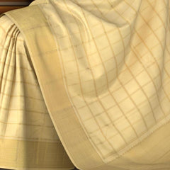 Off White Kanchipuram Silk Saree with Zari Checks on the body with Off White self border and off white grand pallu with diagonal lines. Intricatetly designed with mangoes, rudraksham and Aramadam