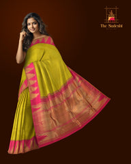 Lime Green Kanchipuram Silk Saree with Plain on the body with Rani Pink contrast Temple border and Rani Pink 8 Kol grand tissue pallu with seepu raku