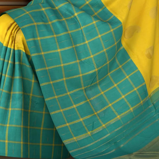Yellow Kanchipuram Silk Saree with Half half- Mango Plain on the body with Turqoise Blue contrast Checks raindrops border and Turqoise Blue 8 Kol grand tissue pallu with seepu raku