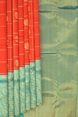 Chilli Red Kanchipuram Silk Saree with Checks on the body with Turqoise Blue contrast Lotus Border and Blue Blue Tissue Pallu. Grand.