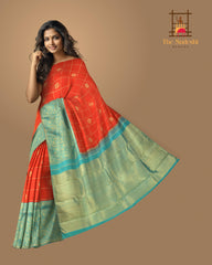 Chilli Red Kanchipuram Silk Saree with Checks on the body with Turqoise Blue contrast Lotus Border and Blue Blue Tissue Pallu. Grand.