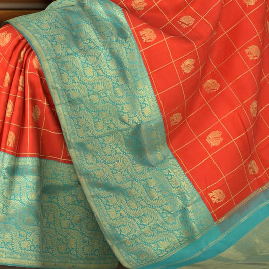 Chilli Red Kanchipuram Silk Saree with Checks on the body with Turqoise Blue contrast Lotus Border and Blue Blue Tissue Pallu. Grand.