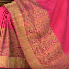 Rani Pink Kanchipuram Silk Saree with Jackard Half and half saree. Half with Mayil, Yaali checks motif. Other half is plain body with Semi circle border and Pink Rudraksham with Annapakshi Checks Pallu