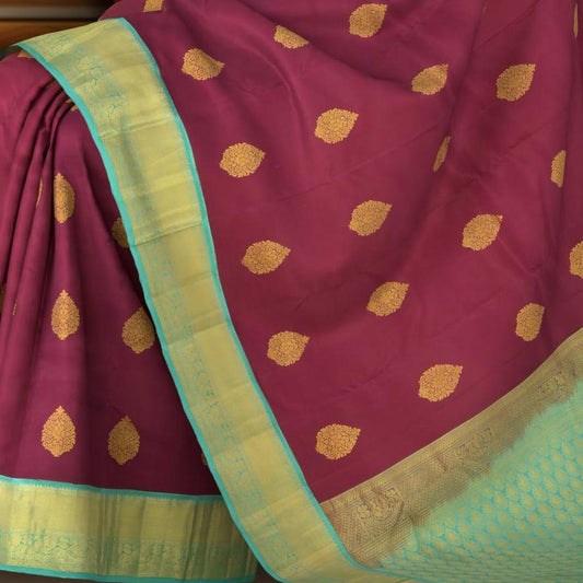 Purple Kanchipuram Silk Saree with Blue contrast border and Blue Pallu with tear shaped motif and annam