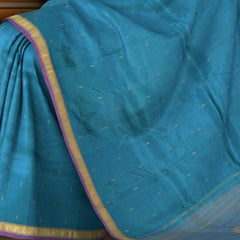 Blue Kanchipuram Silk Saree with Purple contrast border and Dull Blue Pallu with Mango Motif