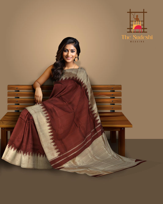 Maroon Kanchipuram Silk Saree with temple border on the body with Maroon self border and Maroon Grand Tissue Pallu