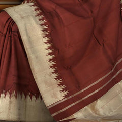 Maroon Kanchipuram Silk Saree with temple border on the body with Maroon self border and Maroon Grand Tissue Pallu