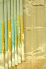 Light Green Kanchipuram Silk Saree with Long Border on the body with Mustard and Green dual color border and 8 Kol Seepu Reku Grand Tissue Pallu. Silver Zari.