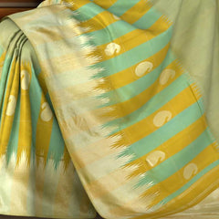 Light Green Kanchipuram Silk Saree with Long Border on the body with Mustard and Green dual color border and 8 Kol Seepu Reku Grand Tissue Pallu. Silver Zari.