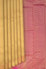 Beige Kanchipuram Silk Saree with Woven on the body with Pink contrast border and Pink Pallu with floral Motif with leaf pattern running across. Intricately designed. Grand