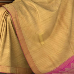 Beige Kanchipuram Silk Saree with Woven on the body with Pink contrast border and Pink Pallu with floral Motif with leaf pattern running across. Intricately designed. Grand