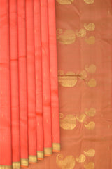 Coral Pink Color Kanchipuram Silk Saree with Silk Saree Small Gold s plain design on the body with cross lines contrast border and Dual Tone Dull Greenish Peach with big mango motif pallu.