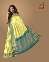 Pale Yellow Kancheevaram Silk Saree with Blue Contrast and Elephant Peacock Bavanshi