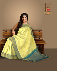 Pale Yellow Kancheevaram Silk Saree with Blue Contrast and Elephant Peacock Bavanshi