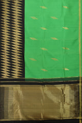 Green Plain Pure Kanchipuram Silk Saree with Diamond Butta and Black Border