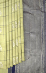 Sublime Harmony: Elaichi Green Pure Silk Saree with Navy Blue Elephant Motifs