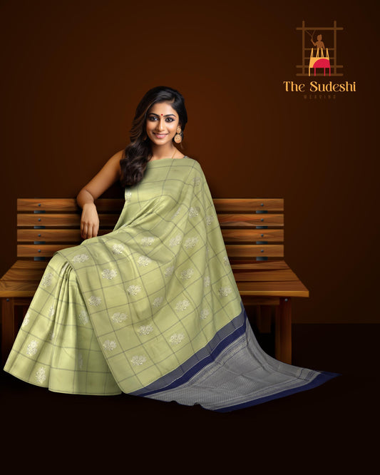 Sublime Harmony: Elaichi Green Pure Silk Saree with Navy Blue Elephant Motifs