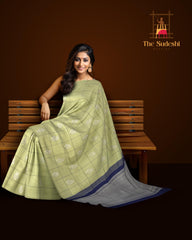 Sublime Harmony: Elaichi Green Pure Silk Saree with Navy Blue Elephant Motifs
