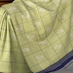 Sublime Harmony: Elaichi Green Pure Silk Saree with Navy Blue Elephant Motifs