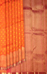 Sunset Orange Kanchipuram Silk Saree with Bhutta and Wave Border – A Radiant Classic