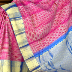 Bright Pink Kanchipuram Silk Saree with Horizontal Stripes and Royal Blue Veldhari Border – Bold, Bright, and Beautiful