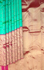 Sea Green Kanchipuram Silk Saree with Long Floral Wave Design Border – Nature-Inspired Elegance in Every Drape