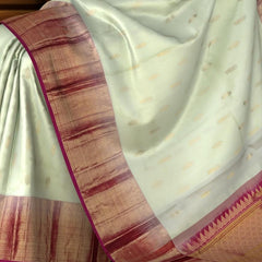 Light Beige Tear Bhutta Kanchipuram Silk Saree with Blue and Copper Accents