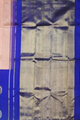 Light Pink Kanchi Pure Silk Saree with Royal Blue Border and Silver-Gold Circle Bhuttas – Subtle Elegance with a Regal Edge