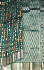 Dark Green Kanchi Pure Silk Saree with Silver Checks and Annam Chakram Butta – A Regal Tribute to Tradition