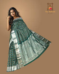 Dark Green Kanchi Pure Silk Saree with Silver Checks and Annam Chakram Butta – A Regal Tribute to Tradition