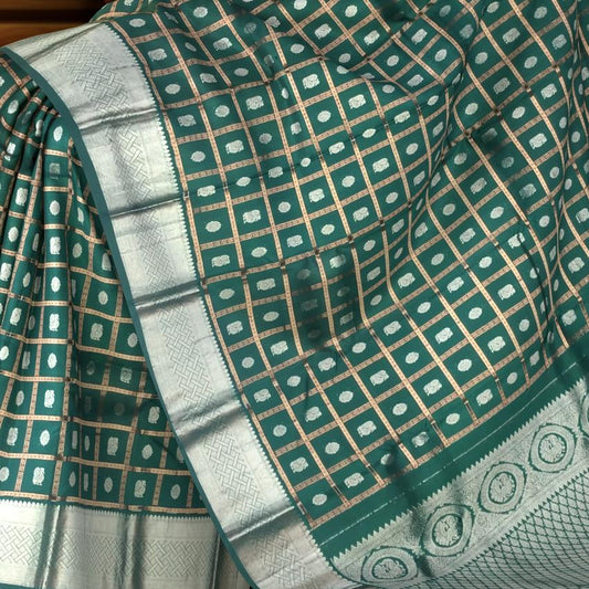 Dark Green Kanchi Pure Silk Saree with Silver Checks and Annam Chakram Butta – A Regal Tribute to Tradition