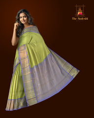 Lime Green Kanchipuram jacquard Silk Saree with embossed diamond design on the body with lavender contrast border and pallu