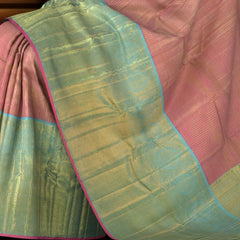 Pink Kanchipuram Silk Saree with checks, tissue, and pink podi kattam designs on the body with powder blue contrast border featuring benarspet with round motif and diamond butta design in pallu
