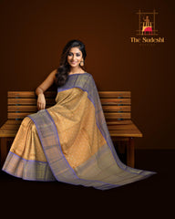 Light Orange Kanchipuram Silk Saree with large diamond motif design on the body with lavender contrast border featuring varusai pet border and annam, small diamond designs in pallu