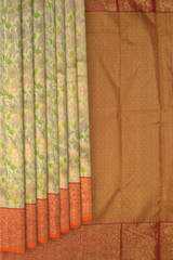 Gold Kanchipuram tissue Silk Saree with multicolor floral embossed designs on the body with red contrast border and diamond design pallu with floral motif