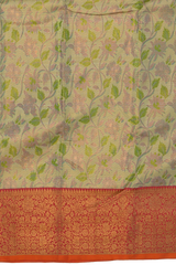 Gold Kanchipuram tissue Silk Saree with multicolor floral embossed designs on the body with red contrast border and diamond design pallu with floral motif