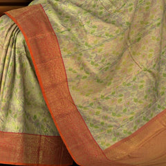 Gold Kanchipuram tissue Silk Saree with multicolor floral embossed designs on the body with red contrast border and diamond design pallu with floral motif