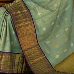 Light Blue Kanchipuram Tissue Silk Saree with embossed designs on the body with violet contrast border and annam, gatti pallu, and grand designs in pallu