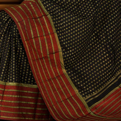 Black Kanchipuram Silk Saree with vertical chakram butta, brocade design on the body with red contrast border and rope design with red threadwork pallu